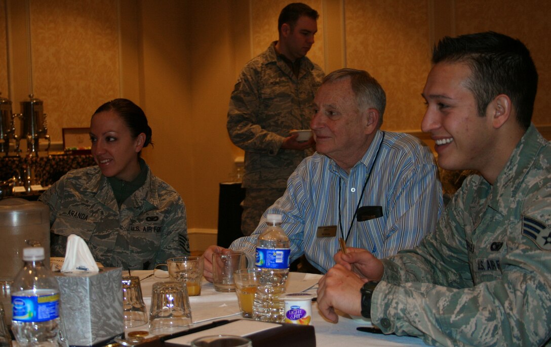 310th Security Forces Staff Sgt. Maria Aranda, Military Family Life Consultant William Zautke and 310th Security Forces Senior Airman Alejandro Barreas look on during the Yellow Ribbon Reintegration Program event Feb. 6, 2010 at the Antler's Hilton, in Colorado Spring, Colo.