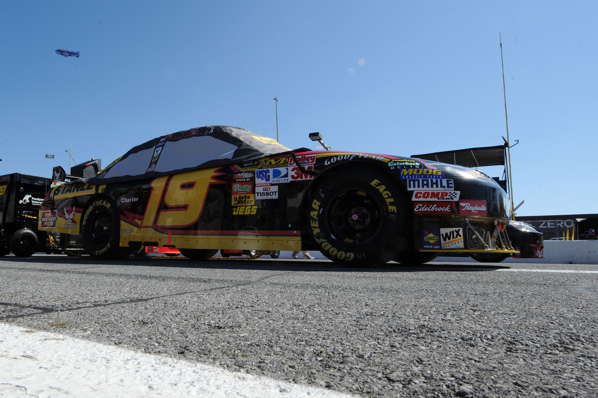 DAYTONA BEACH, Fla. - No. 19 car, driven by Elliot Sadler, sits on the track prior to the start of the Daytona 500 Feb. 14, 2010. As an associate sponsor, the Air Force will feature the dark blue paint scheme on the No. 19 car in five of 37 NASCAR races this season. Approximately 200,000 fans gathered at the Daytona 500 to watch 43 of the best stock car drivers compete in NASCAR's biggest race. (U.S. Air Force photo/Senior Airman Jessica Mae Snow) (Released)  