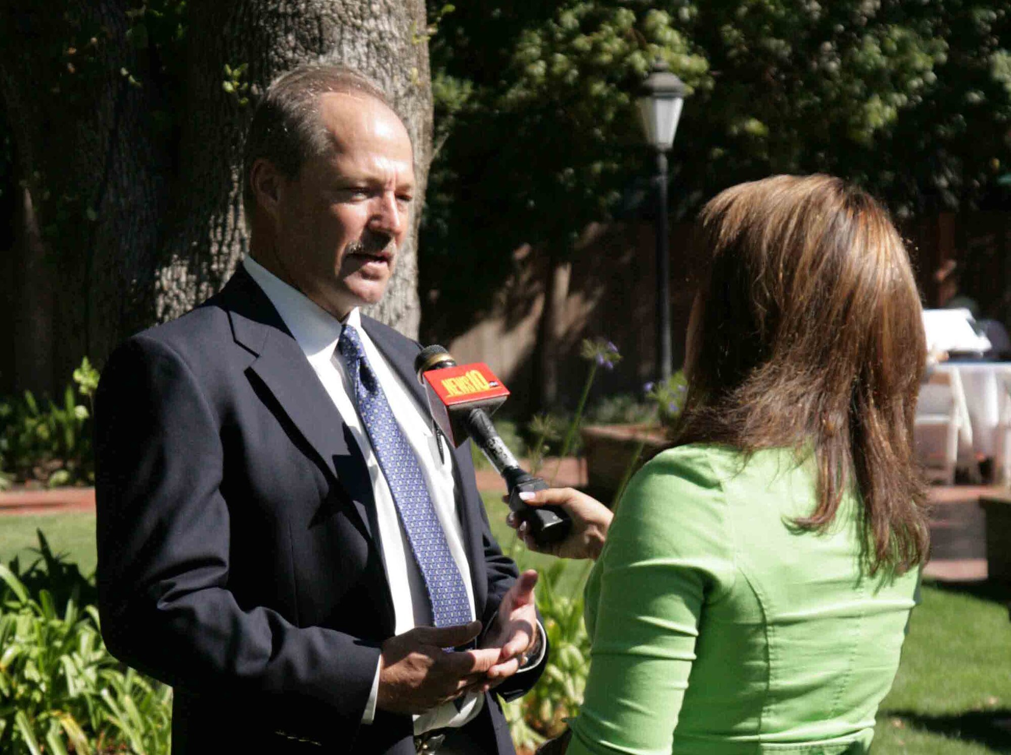 Phil Mook, the Senior Representative for the Air Force Real Property Agency’s Western Region Execution Center at the former McClellan AFB , CA is interviewed by a local newscaster about base closure issues.  He is the top manager for the cleanup and transfer of more than seven major military bases in California and Arizona. 