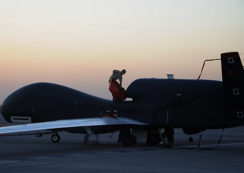 Staff Sgt. Michael Goenner, an RQ-4 Global Hawk crew chief with the 380th Expeditionary Aircraft Maintenance Squadron Hawk aircraft maintenance unit, goes through pre-flight servicing while preparing a Global Hawk for a combat mission Feb. 12, 2010, at a non-disclosed base in Southwest Asia. The RQ-4s, assigned to the 380th Air Expeditionary Wing and deployed from Beale Air Force Base, Calif., achieved 1,500 combat sorties and 30,000 combat flying hours on Feb. 10 and 11 respectively.  Sergeant Goenner is deployed from the 9th Aircraft Maintenance Squadron at Beale AFB, and his hometown is Becker, Minn. (U.S. Air Force Photo/Master Sgt. Scott T. Sturkol/Released)