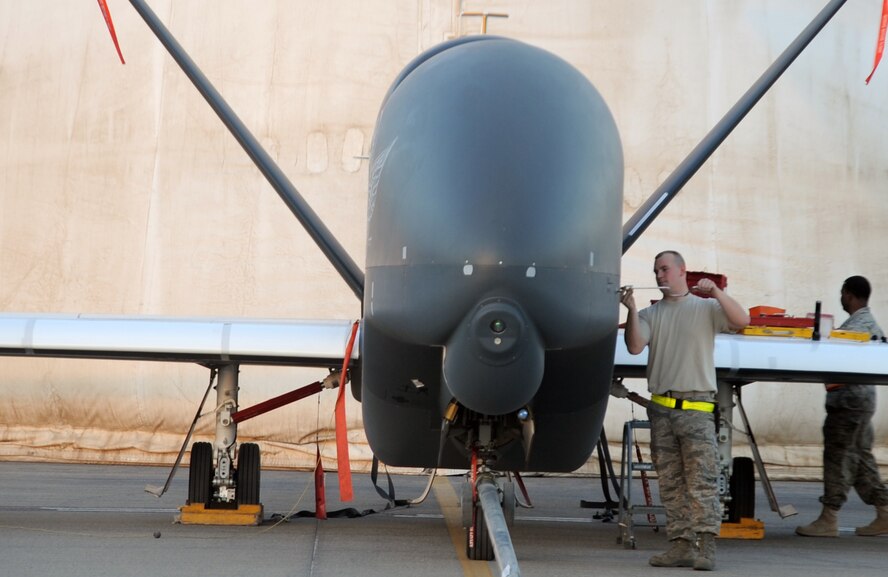 RQ-4 Global Hawk maintenance Airmen with the 380th Expeditionary Aircraft Maintenance Squadron Hawk aircraft maintenance unit goes through pre-flight servicing while preparing a Global Hawk for a combat mission Feb. 12, 2010, at a non-disclosed base in Southwest Asia. The RQ-4s, assigned to the 380th Air Expeditionary Wing and deployed from Beale Air Force Base, Calif., achieved 1,500 combat sorties and 30,000 combat flying hours on Feb. 10 and 11 respectively. (U.S. Air Force Photo/Master Sgt. Scott T. Sturkol/Released)