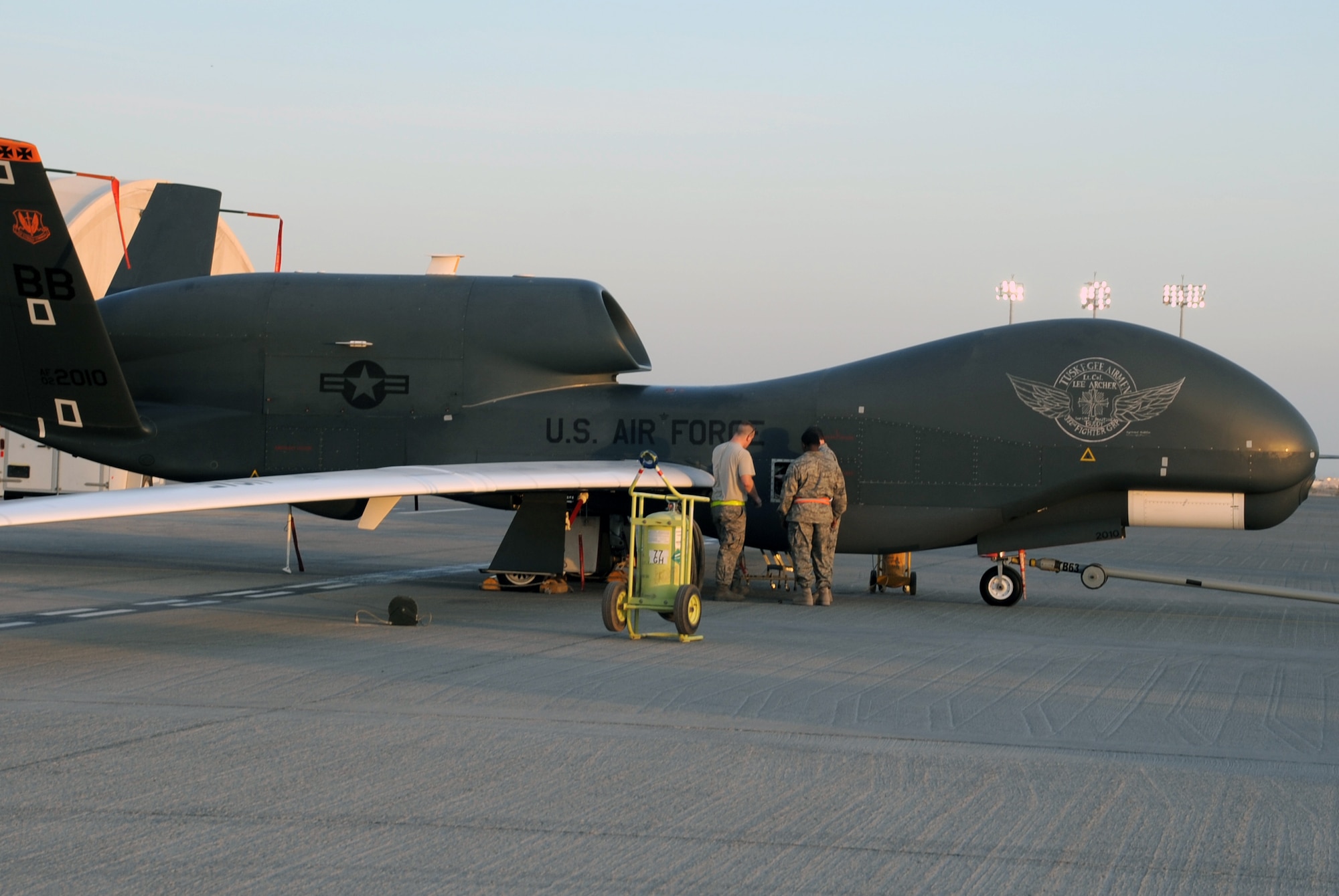 RQ-4 Global Hawk maintenance Airmen with the 380th Expeditionary Aircraft Maintenance Squadron Hawk aircraft maintenance unit goes through pre-flight servicing while preparing a Global Hawk for a combat mission Feb. 12, 2010, at a non-disclosed base in Southwest Asia. The RQ-4s, assigned to the 380th Air Expeditionary Wing and deployed from Beale Air Force Base, Calif., achieved 1,500 combat sorties and 30,000 combat flying hours on Feb. 10 and 11 respectively. (U.S. Air Force Photo/Master Sgt. Scott T. Sturkol/Released)