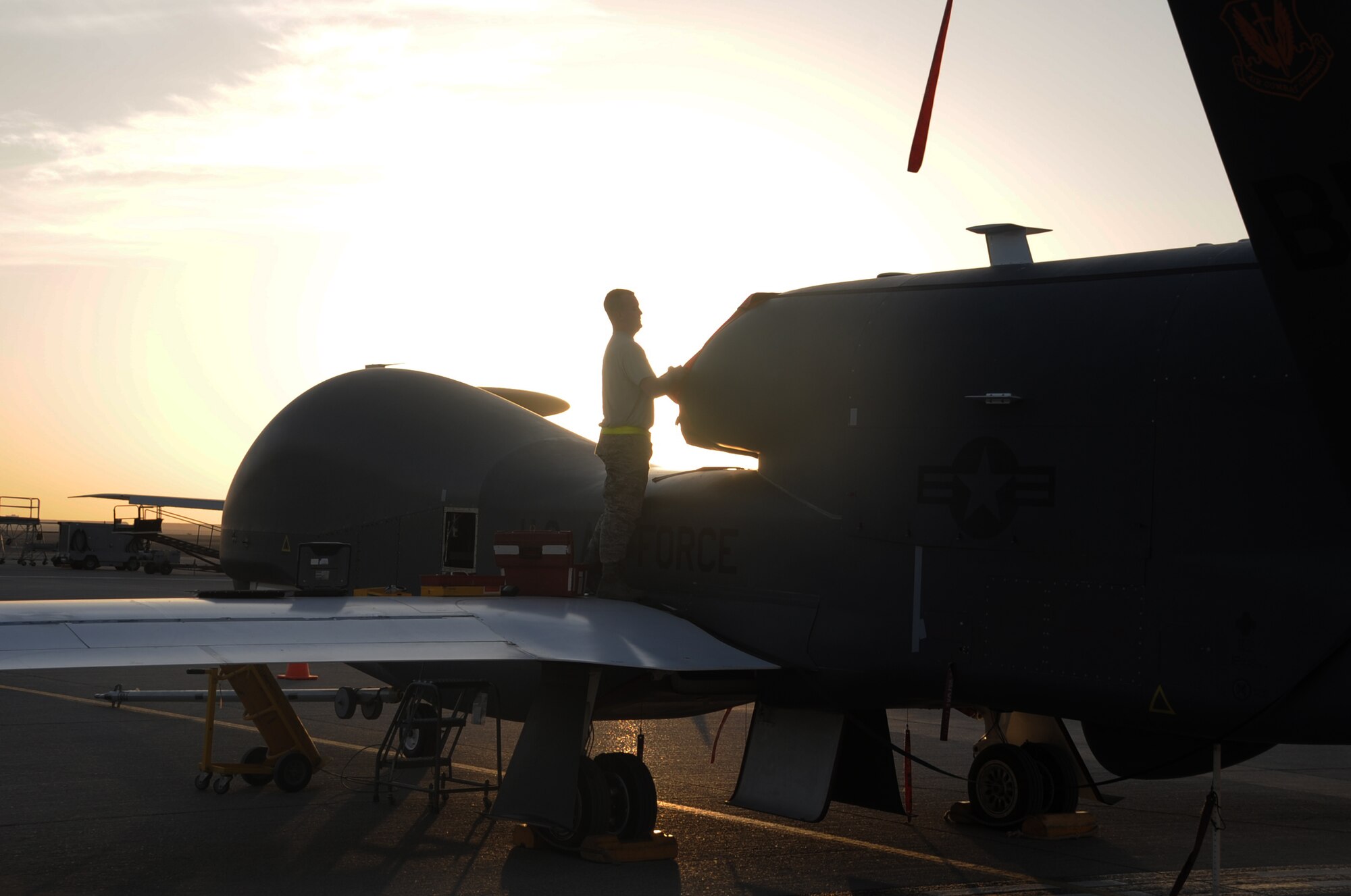 Staff Sgt. Michael Goenner, an RQ-4 Global Hawk crew chief with the 380th Expeditionary Aircraft Maintenance Squadron Hawk aircraft maintenance unit, goes through pre-flight servicing while preparing a Global Hawk for a combat mission Feb. 12, 2010, at a non-disclosed base in Southwest Asia. The RQ-4s, assigned to the 380th Air Expeditionary Wing and deployed from Beale Air Force Base, Calif., achieved 1,500 combat sorties and 30,000 combat flying hours on Feb. 10 and 11 respectively.  Sergeant Goenner is deployed from the 9th Aircraft Maintenance Squadron at Beale AFB, and his hometown is Becker, Minn. (U.S. Air Force Photo/Master Sgt. Scott T. Sturkol/Released)
