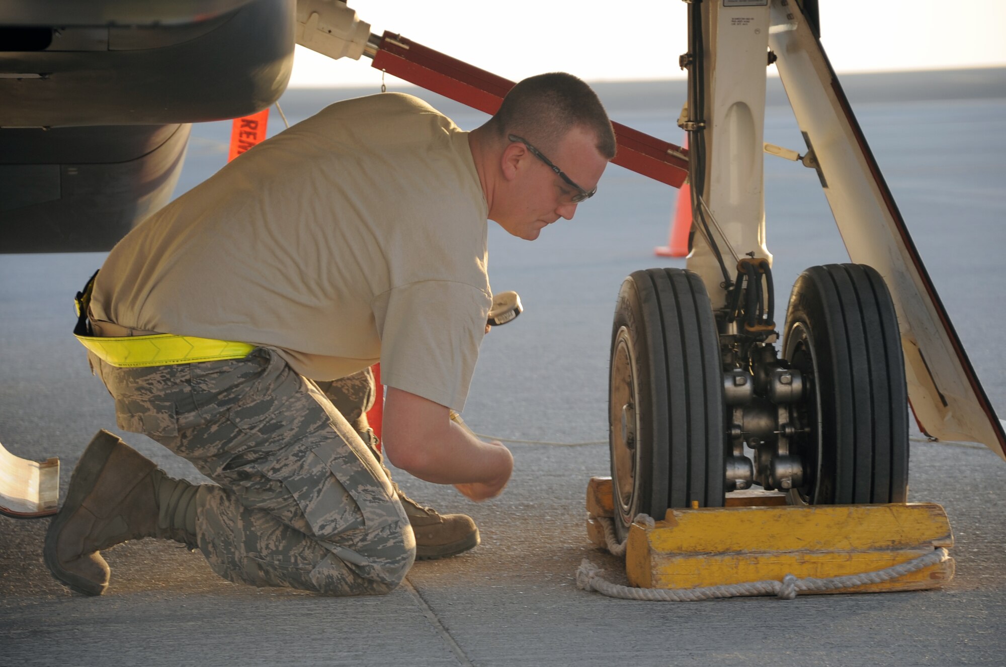 Staff Sgt. Michael Goenner, an RQ-4 Global Hawk crew chief with the 380th Expeditionary Aircraft Maintenance Squadron Hawk aircraft maintenance unit, goes through pre-flight servicing while preparing a Global Hawk for a combat mission Feb. 12, 2010, at a non-disclosed base in Southwest Asia. The RQ-4s, assigned to the 380th Air Expeditionary Wing and deployed from Beale Air Force Base, Calif., achieved 1,500 combat sorties and 30,000 combat flying hours on Feb. 10 and 11 respectively.  Sergeant Goenner is deployed from the 9th Aircraft Maintenance Squadron at Beale AFB, and his hometown is Becker, Minn. (U.S. Air Force Photo/Master Sgt. Scott T. Sturkol/Released)