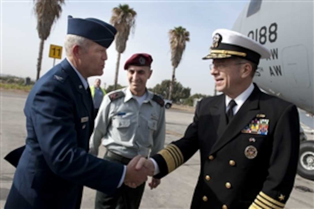 U.S. Air Force Col. Richard Burgess, left, U.S. defense attache to Israel, and Israeli Maj. Gen. Gadi Shamni, center, Israeli defense attache to the United States, greet U.S. Navy Adm. Mike Mullen, chairman of the Joint Chiefs of Staff, upon his arrival in Tel Aviv, Israel,  Feb. 14, 2010. Mullen is on a weeklong tour of the region visiting with key partners and allies. 