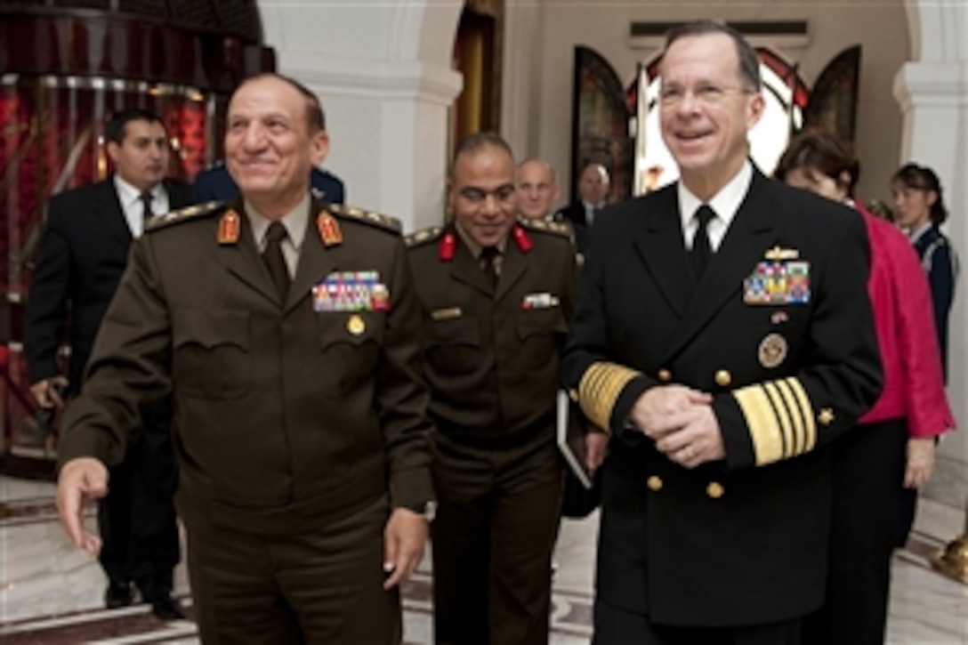 Egyptian Armed Forces Chief of Staff Lt. Gen. Sami Hafez Enan, left, greets U.S. Navy Adm. Mike Mullen, chairman of the Joint Chiefs of Staff, in Cairo, Feb. 14, 2010. Mullen is on a weeklong tour of the region visiting with key partners and allies. 