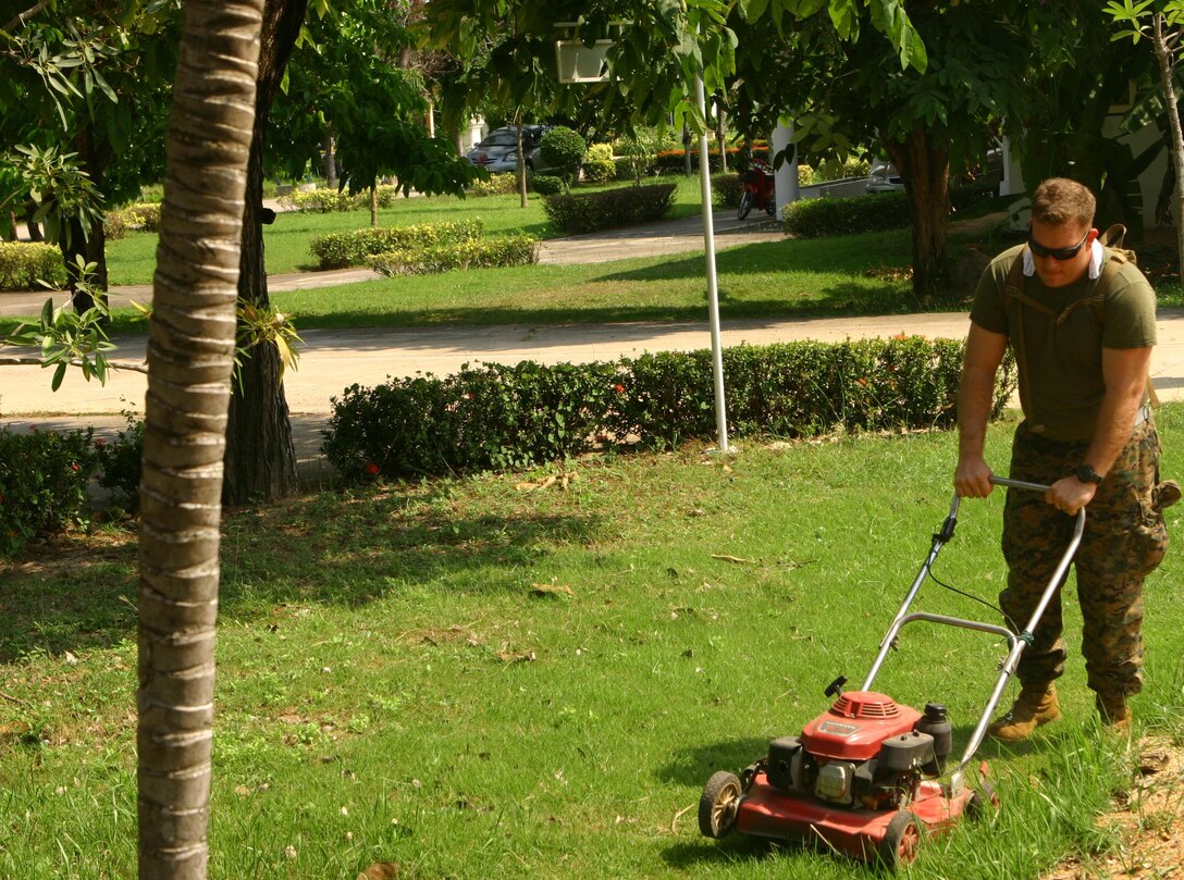 Cpl. Brian Sullivan, a signals intelligence analyst with Radio Battalion, 31st Marine Expeditionary Unit (MEU), operates a lawn mower to cut grass at Karunyawet Home for Disabled Women during a community relations project, Feb. 15. More than 30 service members from the MEU participated in the event. The MEU recently completed Exercise Cobra Gold 2010 (CG ’10) and is currently scheduled to go underway to the Republic of the Philippines in support of Exercise Balikatan 2010 (BK ’10).