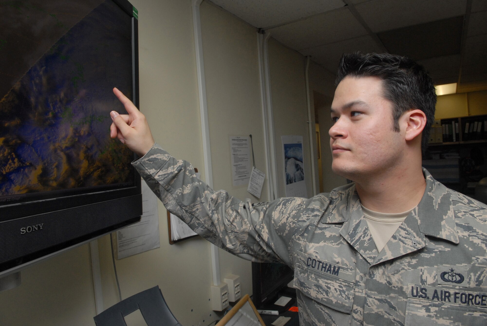 KUNSAN AIR BASE, Republic of Korea -- Staff Sgt. Jack Cotham, 8th Operation Support Squadron weather forecaster, observes data from the Weather Surveillance Radar-1988 Doppler screen during a briefing Feb. 11. Weather Surveillance Radar- 1988 Doppler, commonly called Doppler, detects precipitation and atmospheric movement or wind. (U.S. Air Force photo/Senior Airman Roy Lynch)