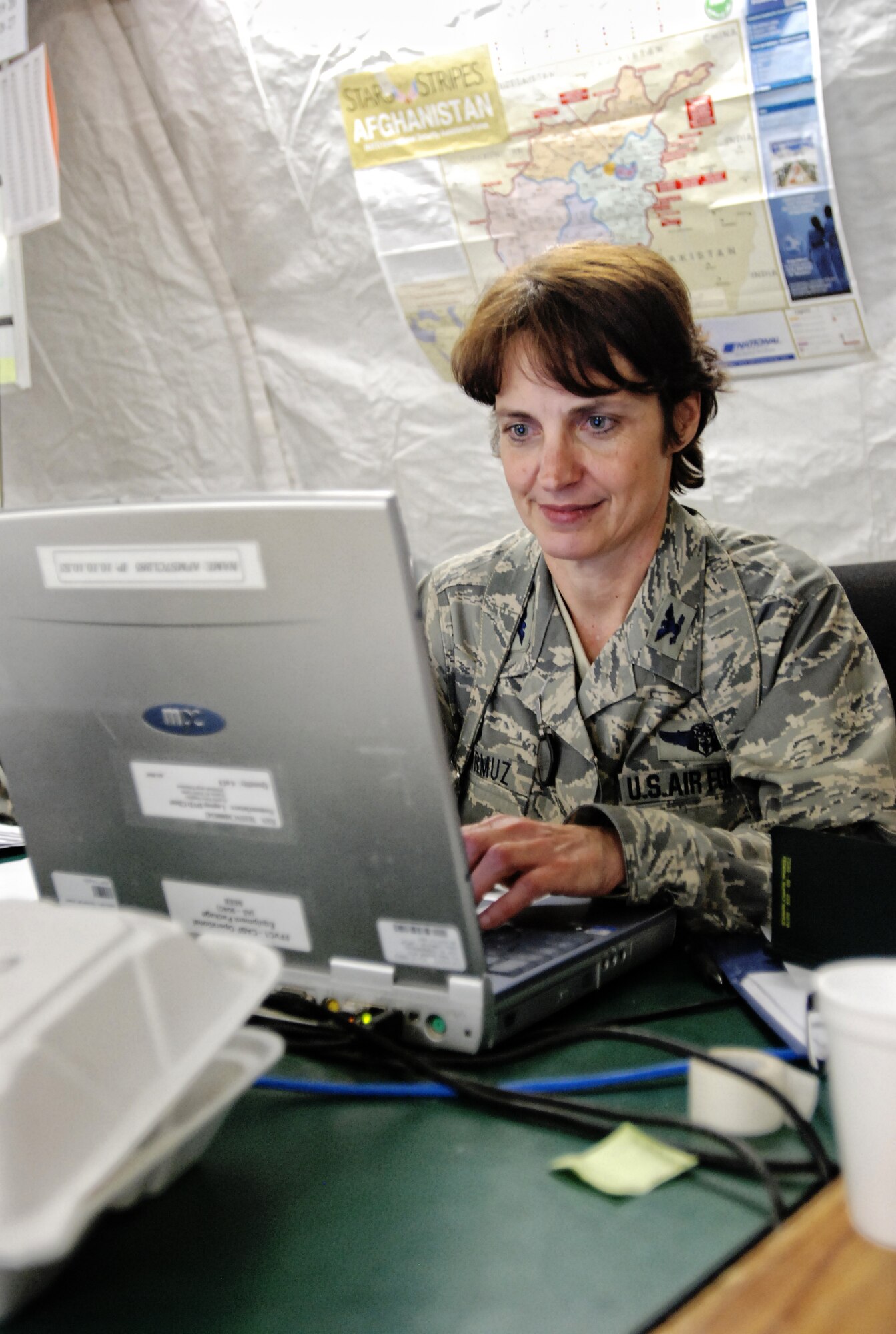 Col. Patricia Jarmuz chief nurse of the 455 Contingency Aeromedical Staging Facility checks the status of a patient at the one of the field hospital staging squadrons in Bagram Airfield, Afghanistan. (Photo by U.S. Air Force SrA Andrew Caya Combined Joint Task Force, U.S. Army 82nd Airbone Division Public Affairs)