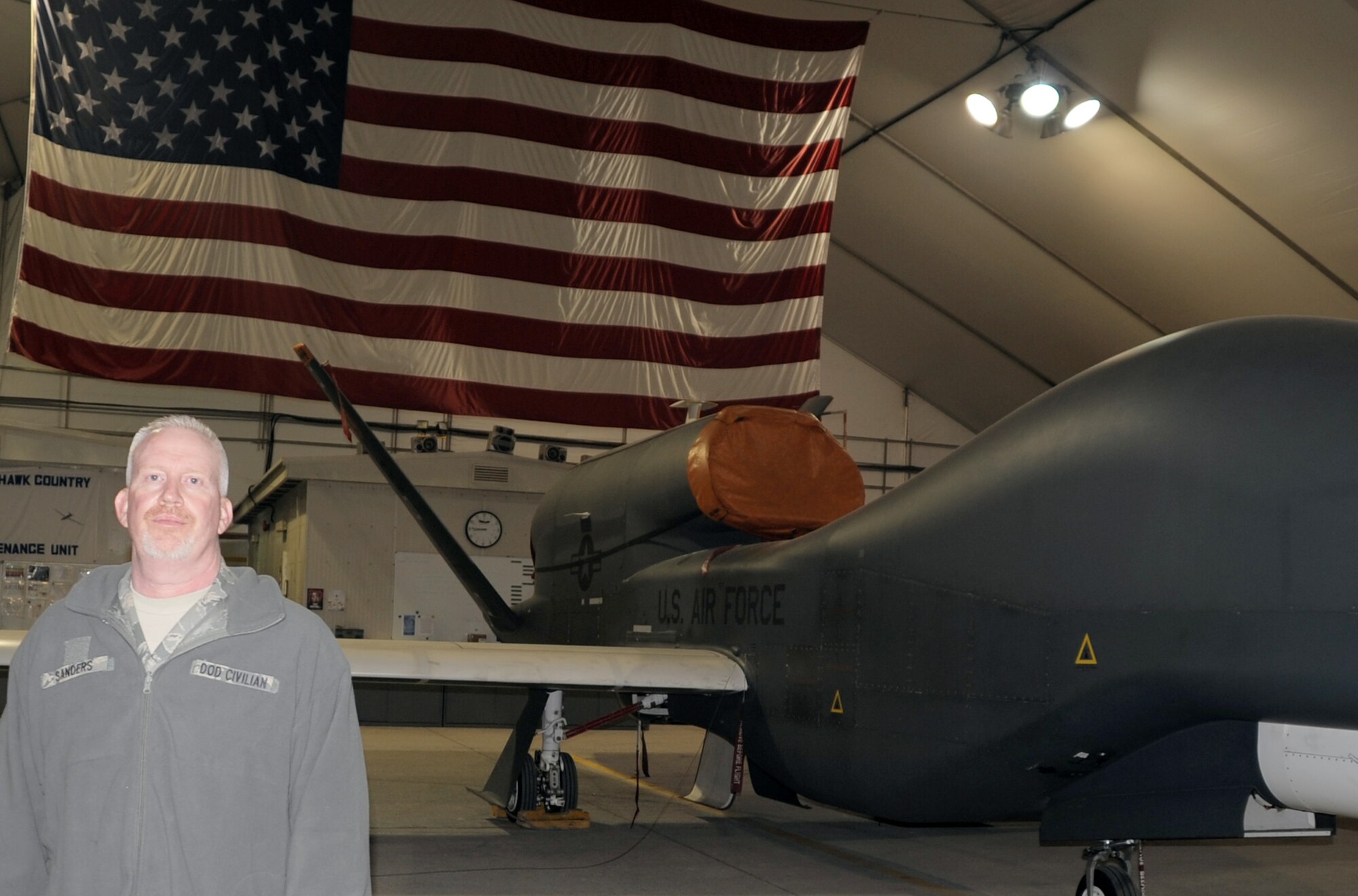 Mr. Mark Sanders is a GS-11 Department of Defense civilian employee and a retired chief master sergeant who works through the Air Force Engineering and Technical Services supporting the RQ-4 Global Hawk mission with the 380th Expeditionary Aircraft Maintenance Squadron Hawk aircraft maintenance unit at a non-disclosed base in Southwest Asia.  Here he is pictured by a Global Hawk on Feb. 12, 2010. He works in ground communications support for the Global Hawk and his hometown is Franklin, N.C. (U.S. Air Force Photo/Master Sgt. Scott T. Sturkol/Released) 