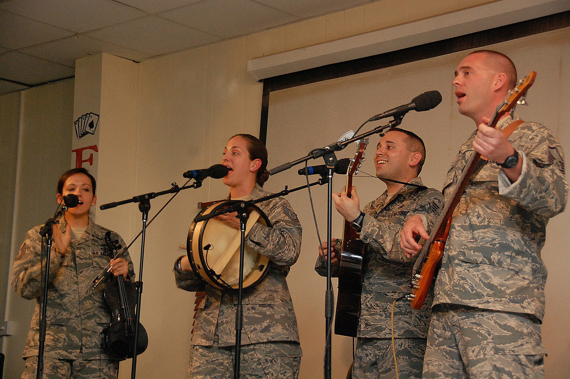 SOUTHWEST ASIA -- Members of the U.S. Air Forces Central Command Celtic Aire band entertain members of the 386th Air Expeditionary Wing Feb. 13, 2010 at the recreation center of an air base in Southwest Asia. The undisclosed location is just one of many stops on the band's two-month tour through the AFCENT area of responsibility. (U.S. Air Force photo by Staff Sgt. Lakisha A. Croley/Released)