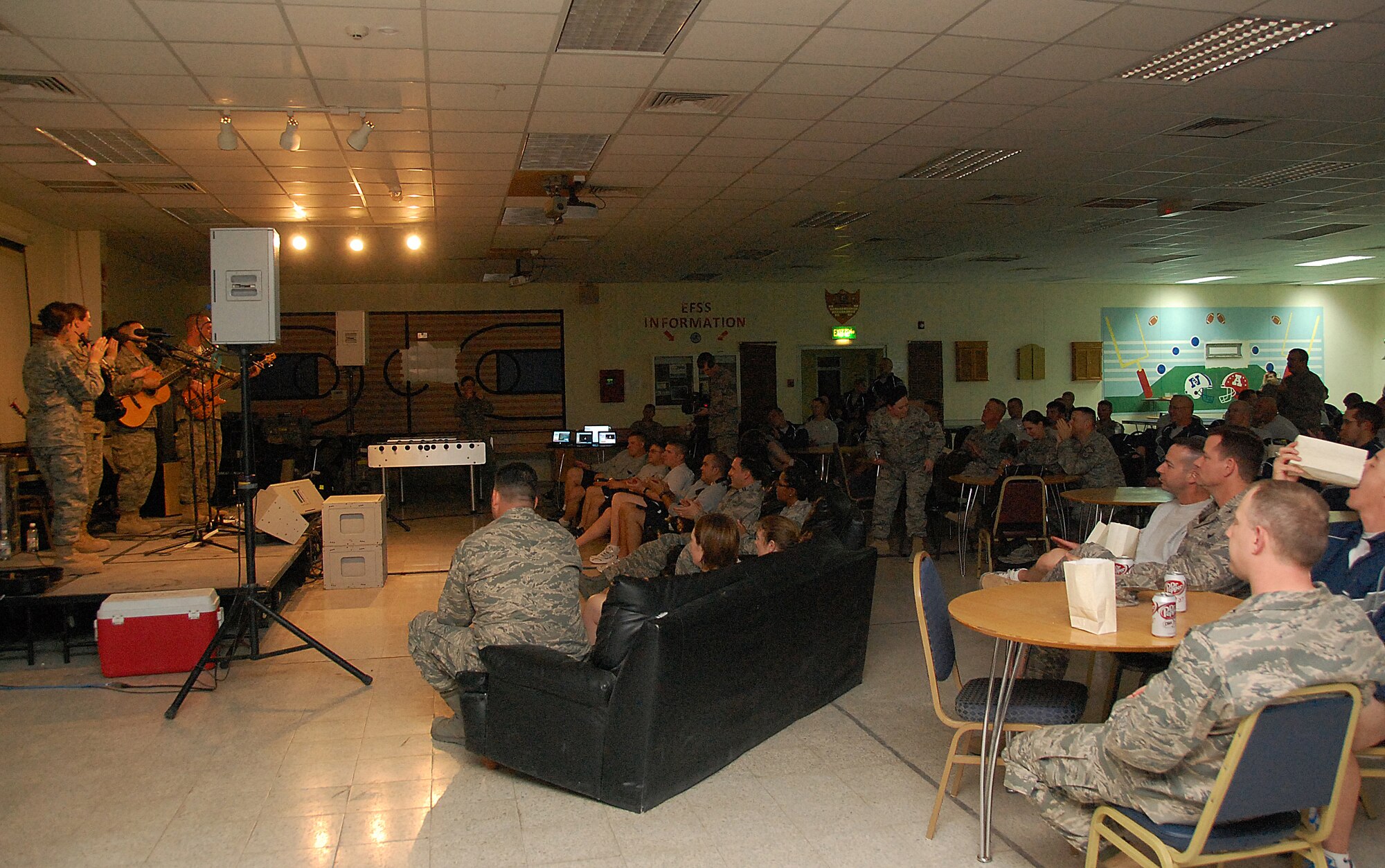 SOUTHWEST ASIA -- Members of the U.S. Air Forces Central Command Celtic Aire band entertain members of the 386th Air Expeditionary Wing Feb. 13, 2010 in the recreation center of an air base in Southwest Asia. The undisclosed location is just one of many stops on the band's two-month tour through the AFCENT area of responsibility. (U.S. Air Force photo by Staff Sgt. Lakisha A. Croley/Released)