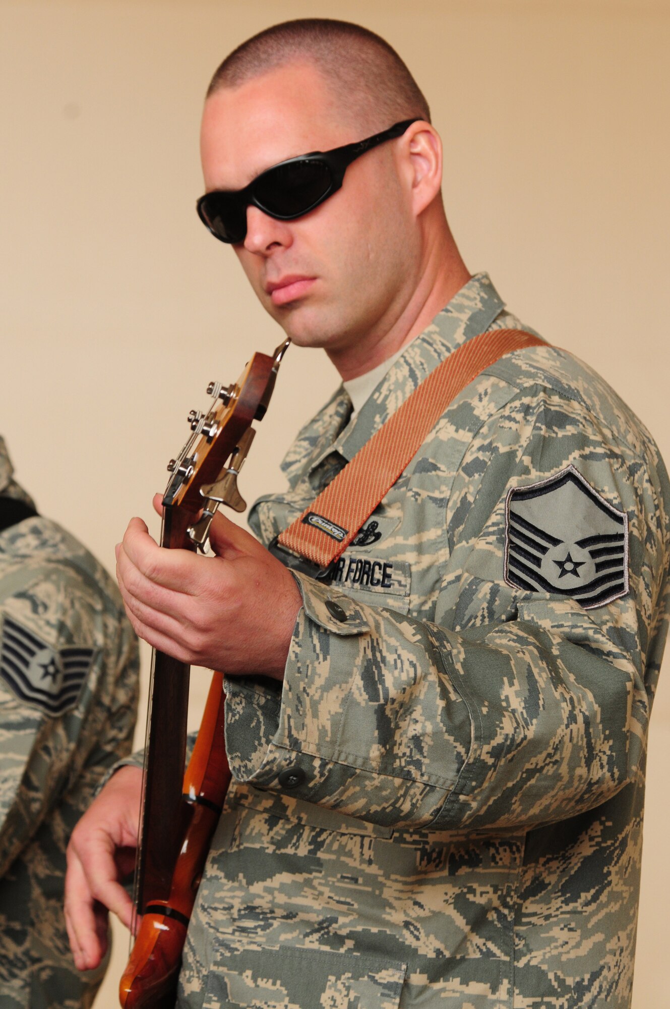 SOUTHWEST ASIA -- U.S. Air Force Master Sgt. Eric Sullivan, guitarist and vocalist for the U.S. Air Forces Central Command Celtic Aire band, performs for members of the 386th Expeditionary Aircraft Maintenance Squadron Feb. 13, 2010 at an air base in Southwest Asia. The undisclosed location is just one of many stops on the band's two-month tour through the AFCENT area of responsibility. (U.S. Air Force photo by Staff Sgt. Lakisha A. Croley/Released)
