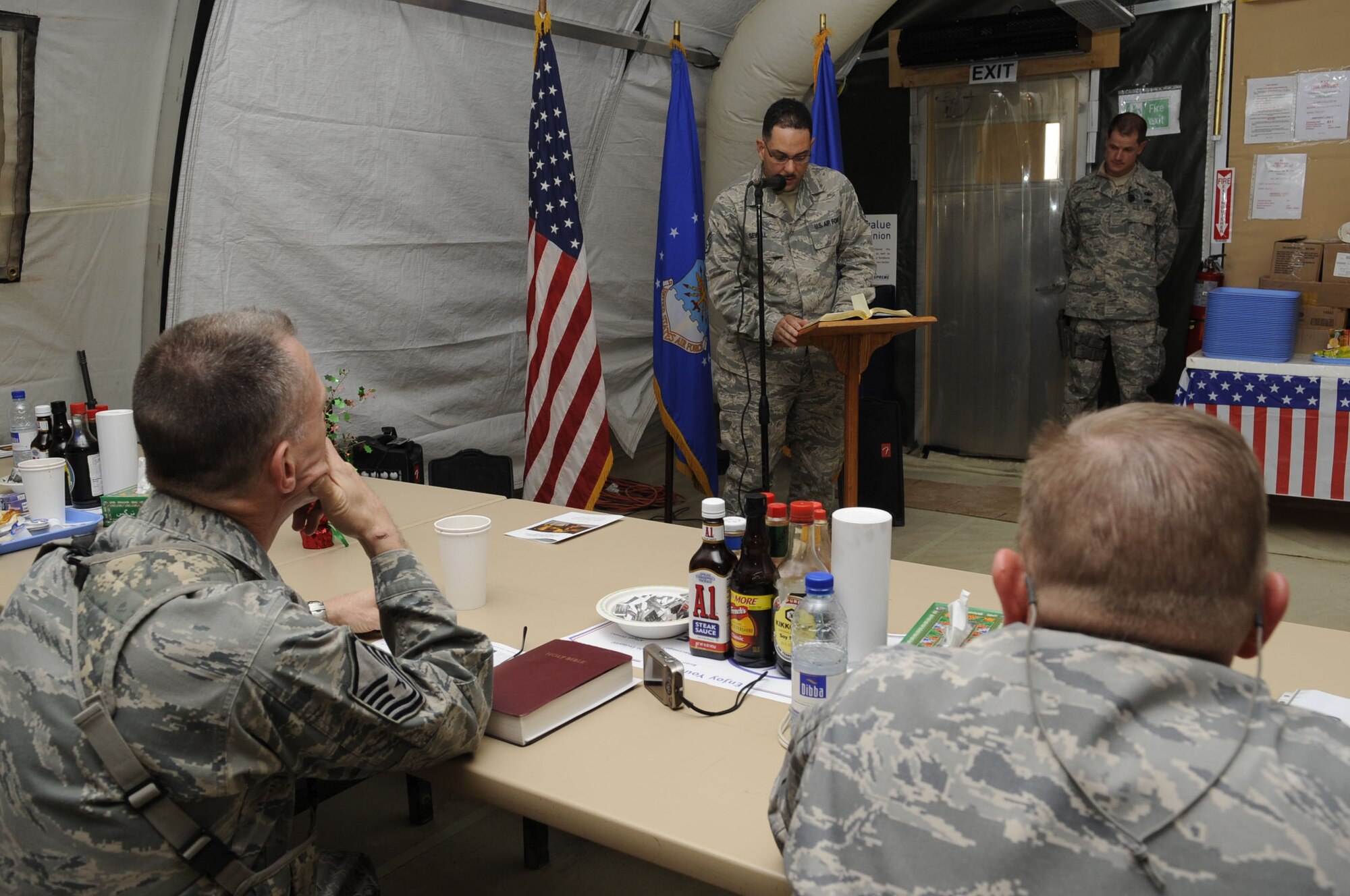 Staff Sgt. James Sewell, 451st Expeditionary Communications Squadron command records manager, reads an Islamic scripture to those who attended the National Prayer Breakfast at the south park dining facility here Feb. 9, 2010.  The National Prayer Breakfast is held annually and is a traditional event used to reaffirm our nation’s spiritual heritage and to seek divine guidance.  (U.S. Air Force photo by Senior Airman Nancy Hooks/Released)