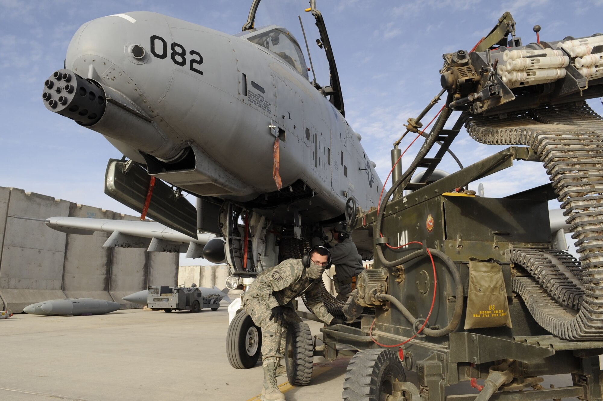 Tech. Sgt. Patrick Hedderick and Master. Sgt. Craig May, 451st Expeditionary Aircraft Maintenance Squadron, reload the A-10 Thunderbolt II 30mm GAU-8/A Avenger Gatling gun here Feb. 11, 2010.  This is the A-10s primary built-in weapon which can hold up to 1,350 rounds of 30 mm ammunition.  (U.S. Air Force photo by Senior Airman Nancy Hooks/Released)  
