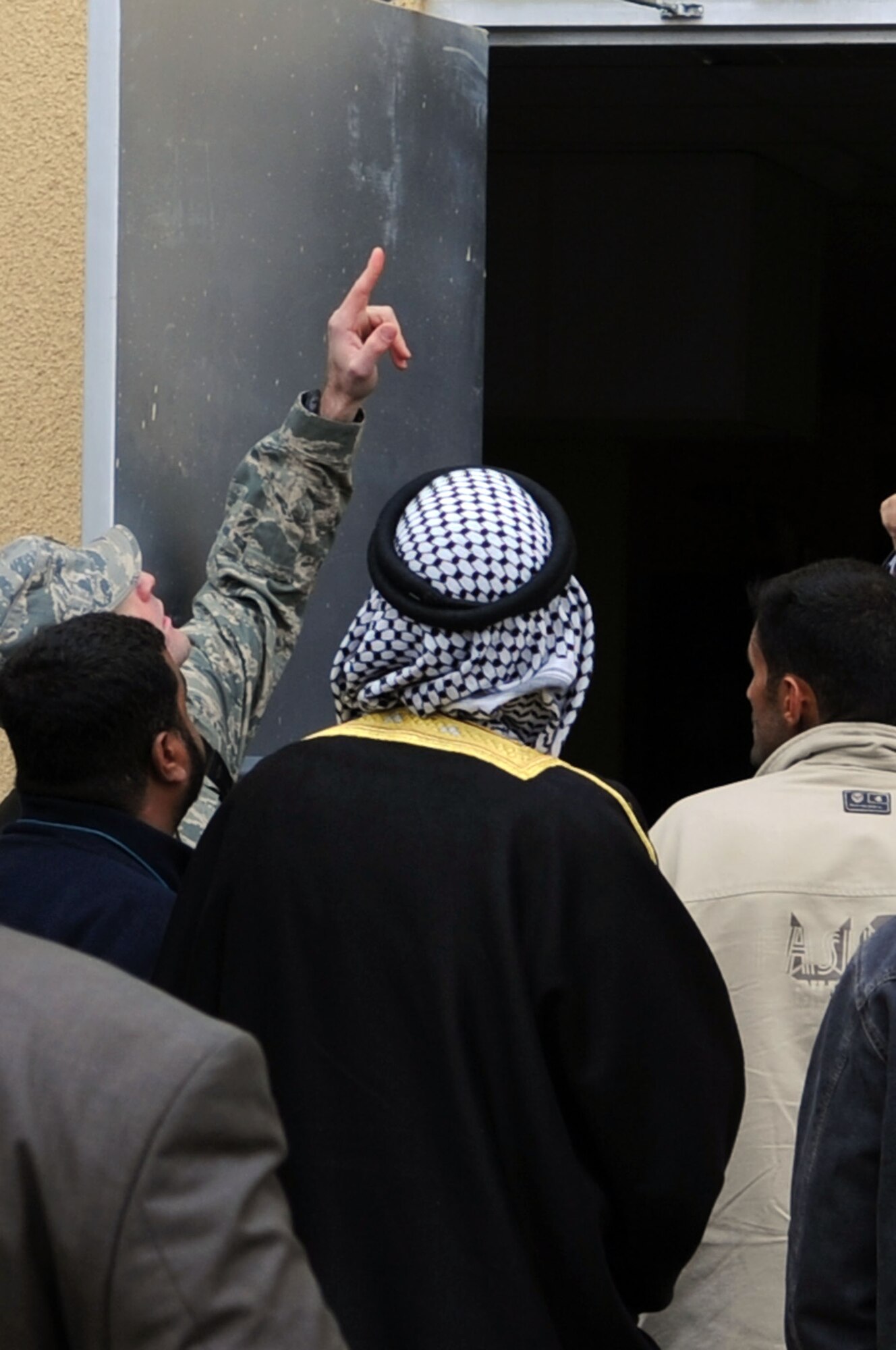 1st Lt. Leslee Roderick of the 332nd Expeditionary Civil Engineer Squadron shows Iraqi contractors one of the three construction sites at Joint Base Balad, Iraq, Feb. 6, 2010. The meeting was the first time a group of local contractors came on base for this type of business. (U.S. Air Force photo/Senior Airman Brittany Y. Bateman/Released)

 
