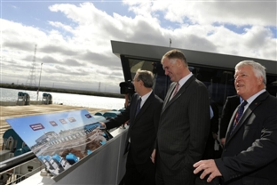 U.S. Deputy Defense Secretary William Lynn III, center,  tours Techport, one of the most modern shipbuilding plants in the world and the $300 million investment in Australia's defense, with Premier Mike Rann, left, during the opening of the common user facility in Adelaide, South Australia, Feb. 15, 2010.