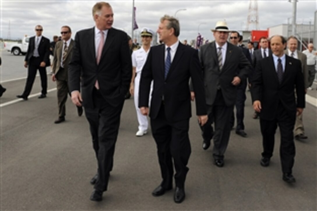 U.S. Deputy Defense Secretary William Lynn III, left, tours Techport, one of the most modern shipbuilding plants in the world and the $300 million investment in Australia's defense, with Premier Mike Rann, right, during the opening of the common user facility in Adelaide, South Australia, Feb. 15, 2010.