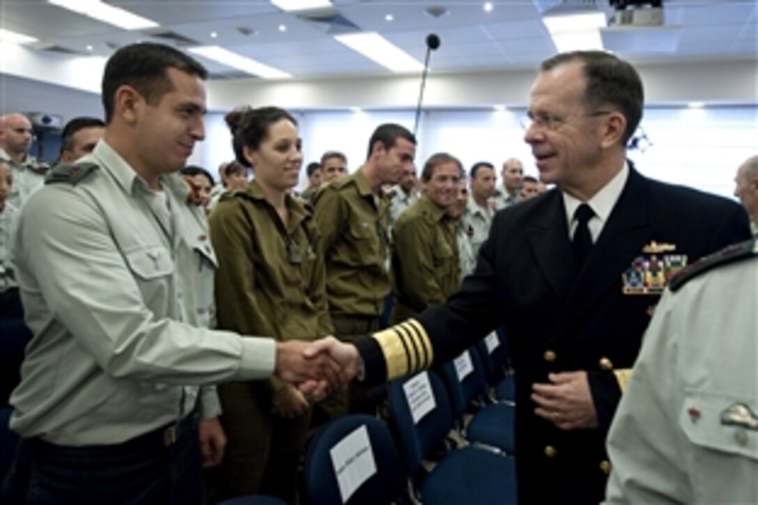 U.S. Navy Adm. Mike Mullen, chairman of the Joint Chiefs of Staff, greets members of the Israeli Defense Force delegation that was dispatched to Port-Au-Prince, Haiti, after the devastating earthquake that struck the island in January. Mullen is on a weeklong tour of the region visiting with key partners and allies.