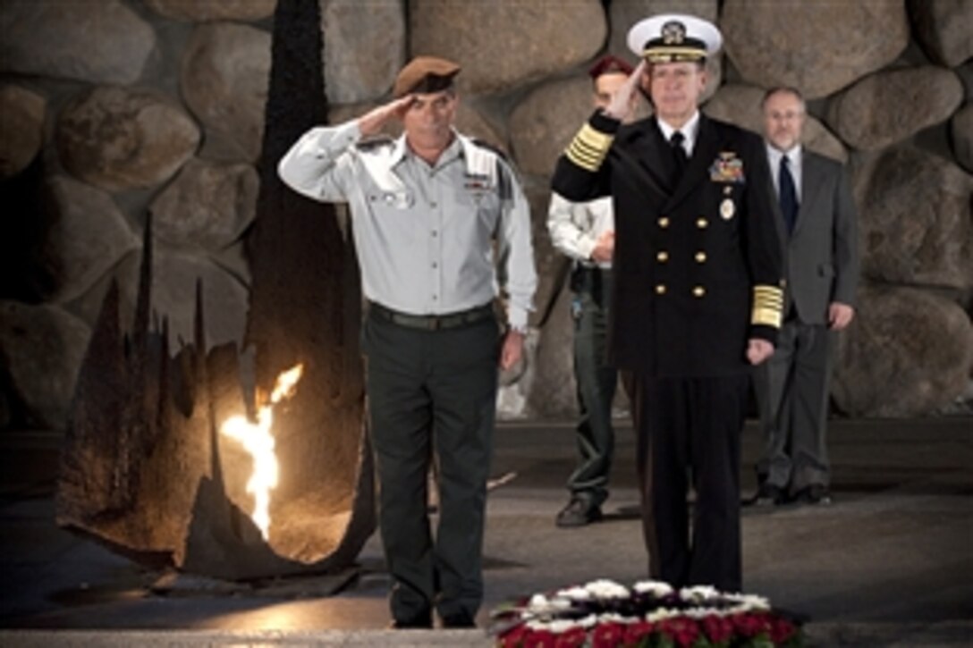 Lt. Gen. Gabi Ashkenazi, chief of defense, Israeli Defense Force, and U.S. Navy Adm. Mike Mullen, chairman of the Joint Chiefs of Staff, present a wreath at the eternal flame at the Yad Ve Shem Holocaust Memorial Museum in Jerusalem, Feb. 15, 2010. Mullen is on a weeklong tour of the region visiting with key partners and allies.