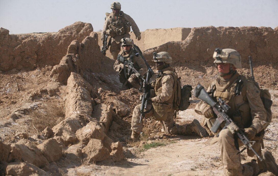 Marines from 3rd Platoon, India Company, 3rd Battalion, 6th Marine Regiment, patrol in Marjah, Helmand province, Afghanistan, Feb. 16, 2010. During the patrol, the Marines found a large cache of improvised explosive device-making materials, which were later destroyed during a controlled detonation. Marines and Afghan National Army soldiers have been conducting Operation Moshtarak to rid Marjah of Taliban presence and intimidation.(USMC photo by Lance Cpl. Tommy Bellegarde)
