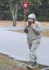 Air Force Reserve Staff Sgt. Tequilla Hines, 919th Mission Support Flight, experiences snowy goings as she crosses a Duke Field street Feb. 12.   While no snow accumulated, the briefly heavy flurries were a rare visual treat for Duke Field personnel in the Sunshine State. (U.S. Air Force photo/Staff Sgt. Jon McCallum)