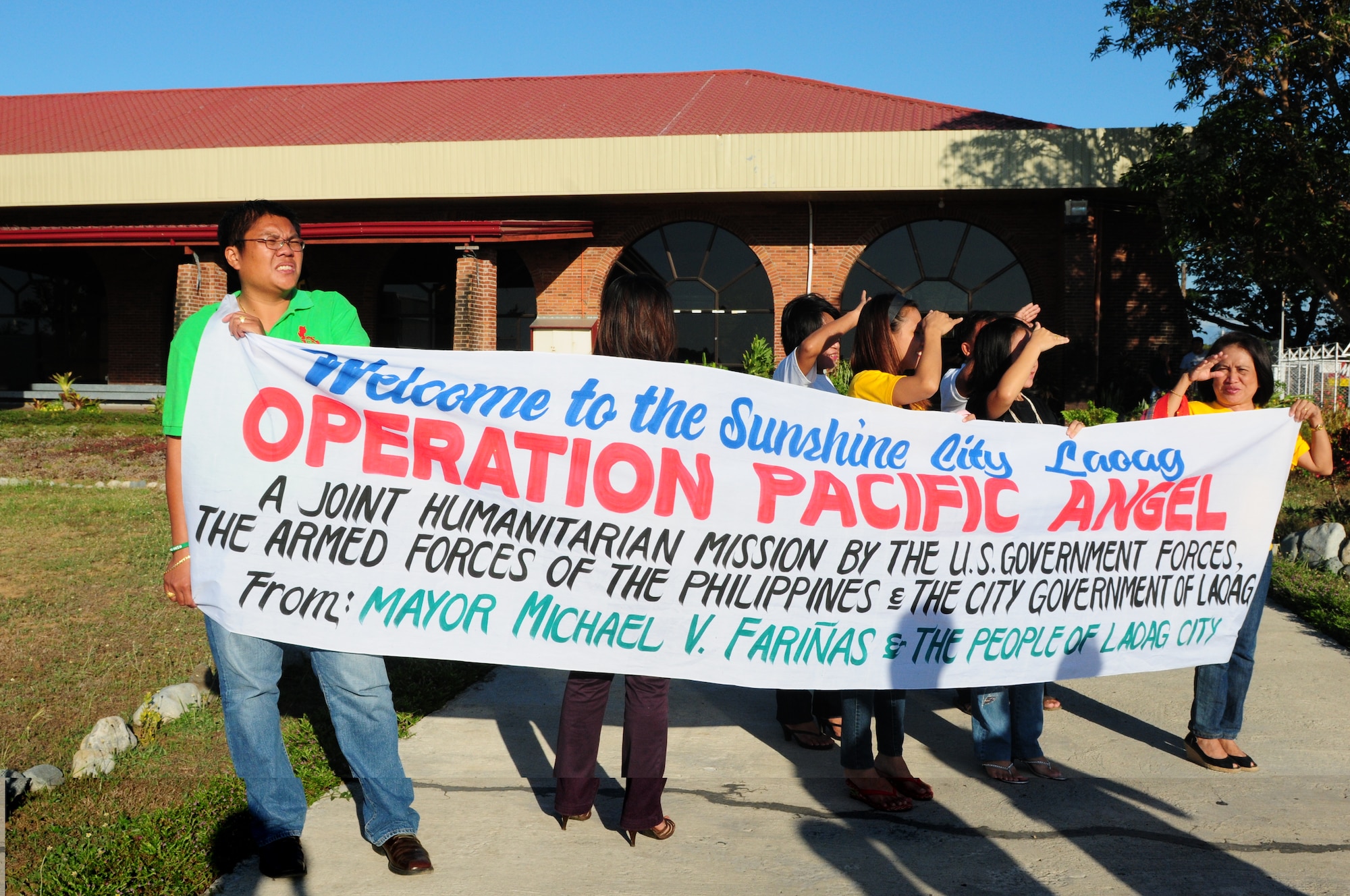 A welcoming committee from the Laoag City Mayor’s Office greets more than 50 military personnel as they arrive in Laoag, Philippines, Feb. 13, to participate in Operation Pacific Angel 10-1. Operation Pacific Angel is a joint and combined humanitarian assistance operation conducted in the Asia-Pacific region to provide medical, dental and engineering assistance. The exercise is schedule through Feb. 22 (U.S. Air Force Photo/Capt. Genieve David)