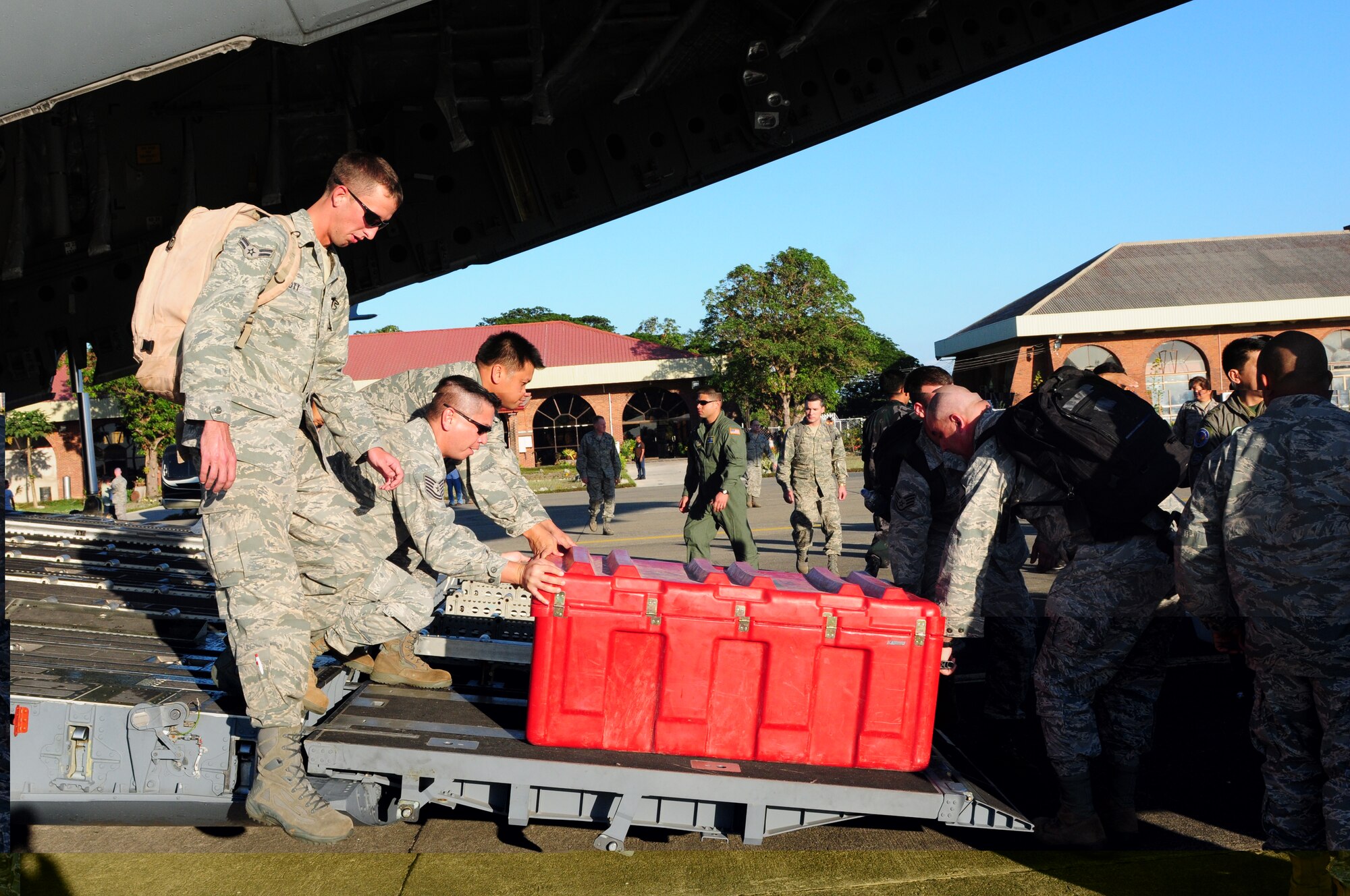 U.S. Air Force members unload cargo from a C-17 Globemaster III during Pacific 
Angel 10-1 at the Laoag International Airport in Laoag, Philippines,  Feb. 13. Operation Pacific Angel is a joint and combined humanitarian assistance operation conducted in the Asia-Pacific region to provide medical, dental and engineering assistance. The exercise is scheduled through Feb. 22 (U.S. Air Force Photo/Capt. Genieve David)
