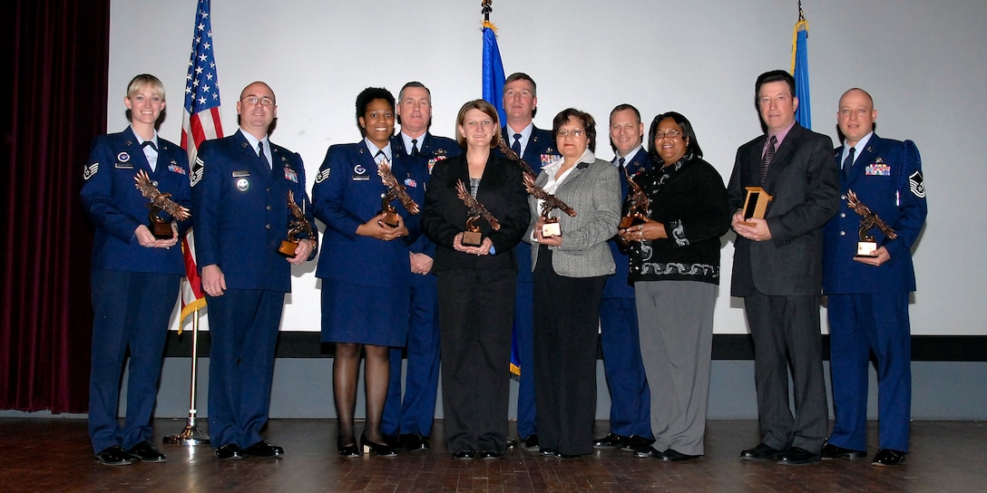 The 82nd Training Wing recognizes the Quarterly Award Winners at the base theater as Brig. Gen. O.G. Mannon (center back left), 82nd TRW commander, and Command Chief Master Sgt. Kenneth Sallinger (center back right), 82nd TRW command chief, present the awards Feb. 11. Those recognized from left to right are, Staff Sgt. Angela Sasser, 366th Training Squadron; Senior Master Sgt. Robert Smith, 82nd Training Operations; Staff Sgt. Markeisha Robinson, 882nd Training Group, Mrs. Bobbie Merrifield, 82nd TRW; Master Sgt. Steven Cummins (center back), 982nd Training Group; Mrs. Melba Medina, 82nd Medical Support Squadron; Mrs. Lula Hill, 82nd Contracting Squadron;  Mr. James Presley, 82nd TRG; Master Sgt. Bradley Ellison, 982nd TRG. Those not pictured are: Capt. Javier Rodriguez, 882nd TRG; Tech. Sgt. Leah Retamoza, 982nd TRG; Staff Sgt. Algelis Rosado, 982nd TRG; Staff Sgt. Keith Morris, 982nd TRG; Senior Airman Christopher Melson, 82nd TRG; Mrs. Rusty Blount,782nd TRG. (U.S. Air Force photo/ Mike Litteken)