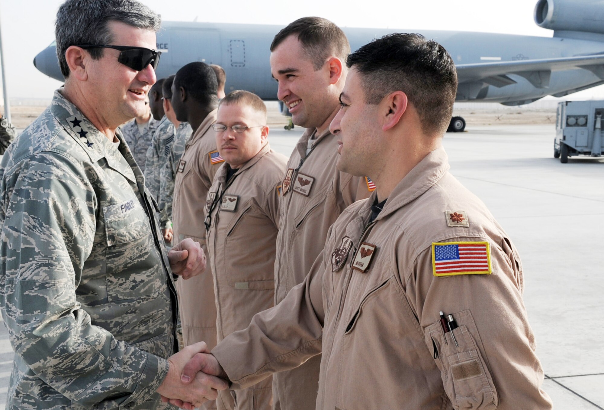 Lt. Gen. Vern M. "Rusty" Findley II meets Maj. Ben Yosfan and other mobility Airmen of the 380th Air Expeditionary Wing Feb. 11, 2010, at an air base in Southwest Asia. General Findley is the Air Mobility Command vice commander at Scott Air Force Base, Ill. (U.S. Air Force photo/Master Sgt. Scott T. Sturkol)
