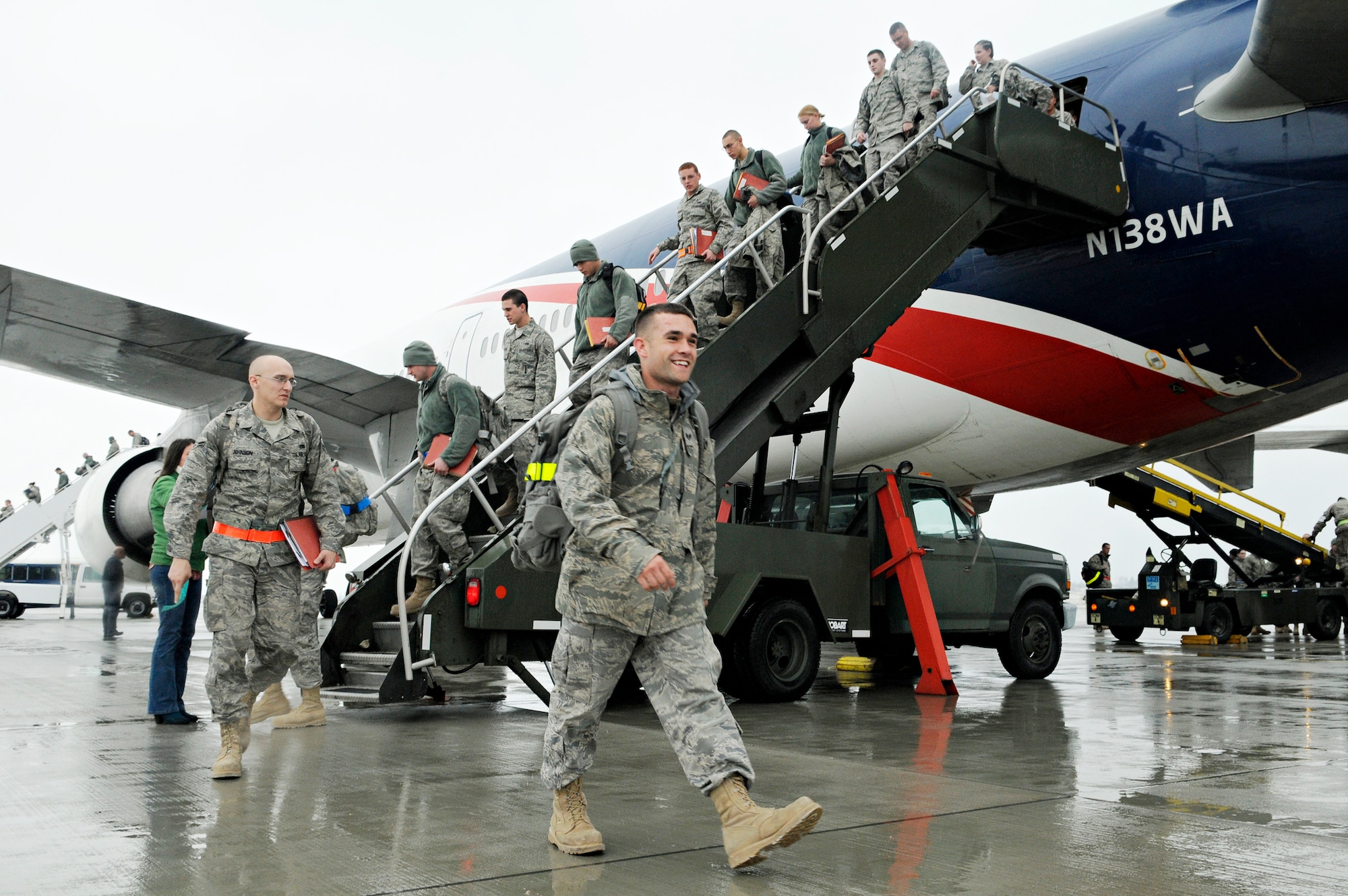 Airmen returning from a deployment make their way to their families at Spangdahlem Air Base, Germany, Feb. 5, 2010. More than 300 members returned to Spangdahlem after a deployment to Joint Base Balad, Iraq, in support of Operation Iraqi Freedom. (U.S. Air Force photo/Senior Airman Benjamin Wilson)