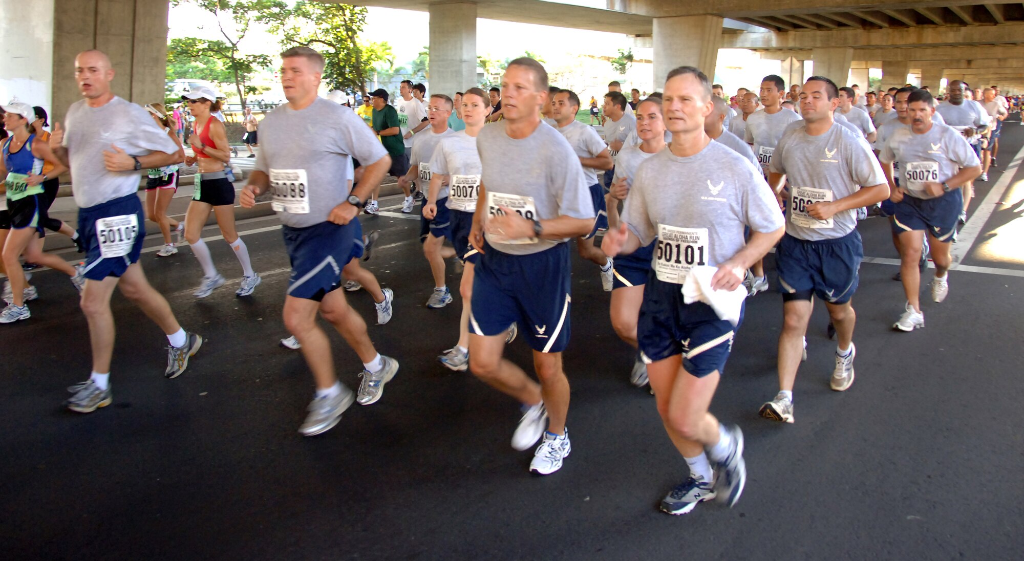 Airmen run in formation at the Great Aloha Run Feb. 15. The run began at Aloha Tower, finished at Aloha Stadium, and boasted more than 17,000 participants. (U.S. Air Force photo by Senior Airman Nathan Allen)
