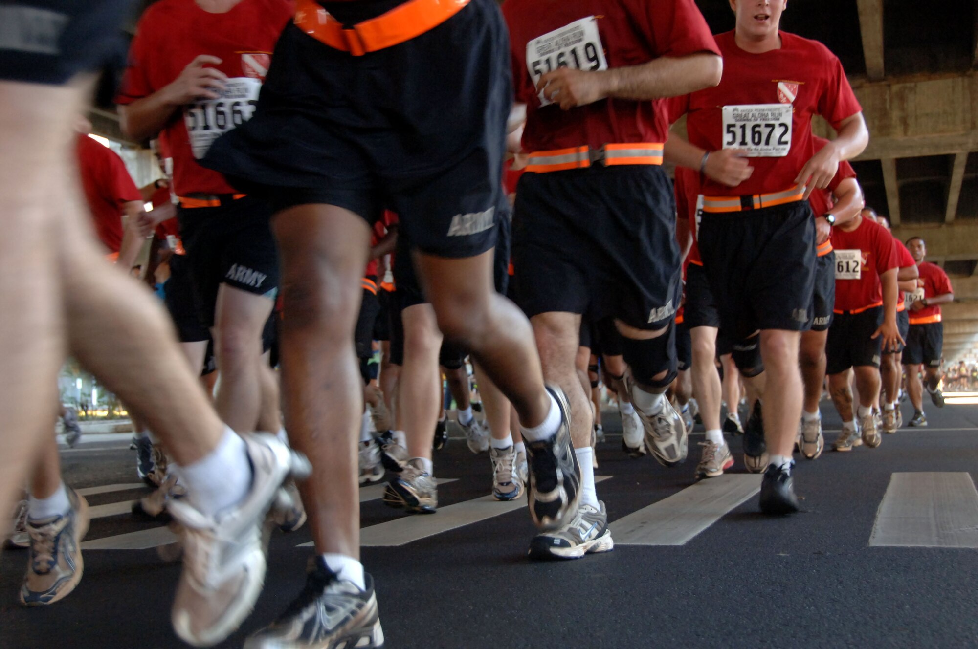 Soldiers run in formation at the Great Aloha Run Feb. 15. The run began at Aloha Tower, finished at Aloha Stadium, and boasted more than 17,000 participants. (U.S. Air Force photo by Senior Airman Nathan Allen)