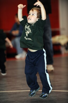 WHITEMAN AIR FORCE BASE, Mo. - Noah Blasdell does jumping-jacks while participating in the Start Smart youth sports development program Feb. 12, 2010.The Whiteman Youth Center provides the Start Smart program to children ages 3-to 5- years-old. The program introduced the children to different sports including basketball, soccer, T-ball and flag football. (U.S. Air Force photo/Tech. Sgt. Charles Larkin Sr)
