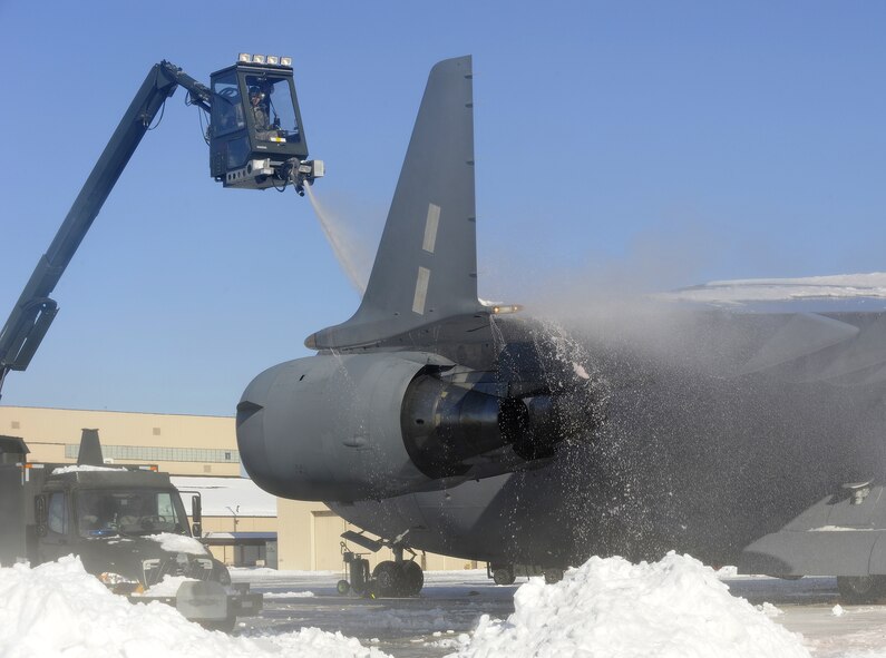 Members of the 305th Maintenance Group  deice a C-17 Globe master Feb. 12 after a snow storm dumped 12-18 inches of snow in the area. Joint Base McGurie-Dix-Lakehurst personnel who were not mission or weather essential were urged to stay home during the storm to allow snow removal teams to clear the streets and parking lots. (U.S. Air Force photo Carlos Cintron)
