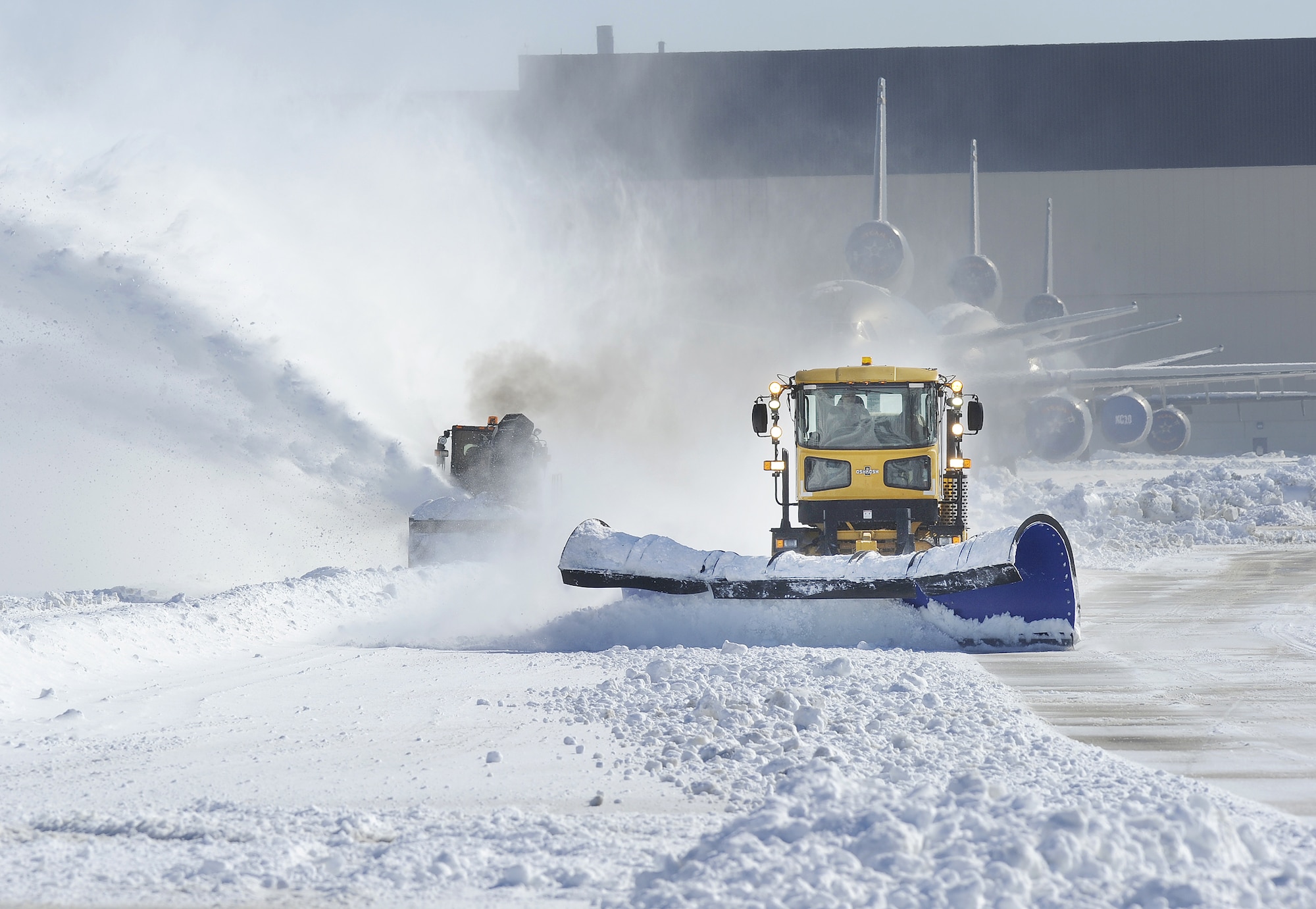 Members of the 87th Civil Engineer Squadron heavy equipment shop were out in force Feb. 12 removing tons of snow from the airfield runways, taxiways and parking ramps after a snow storm dumped 12-18 inches of snow in the area. The snowplows were running "around the clock" to remove snow from streets and parking lots at Joint Base McGuire-Dix-Lakehurst, N.J. (U.S. Air Force photo Carlos Cintron)
