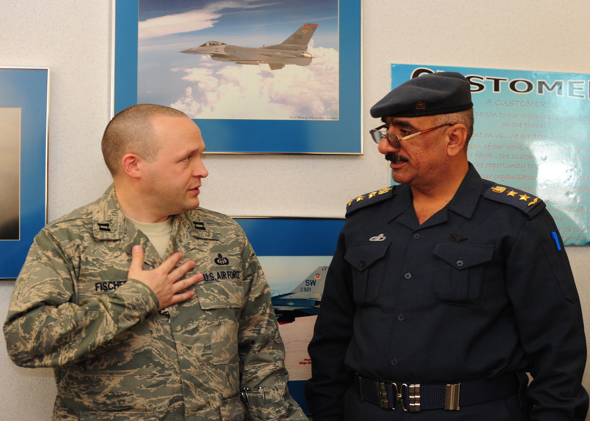 SHAW AIR FORCE BASE, S.C. -- Capt. David Fischer (left), 20th Operations Support Squadron weather flight commander, explains the 20th OSS mission to Col. Salman, Iraqi Air Force Meteorological Department director and senior meteorologist Feb. 16.  Col. Salman develops doctrine, policy, requirements and standards to organize, train and equip the meteorological department to support the Iraqi Air Force as well as the ministry of defense and other government of Iraq agencies. (U.S. Air Force photo/2nd Lt. Tony Richardson)