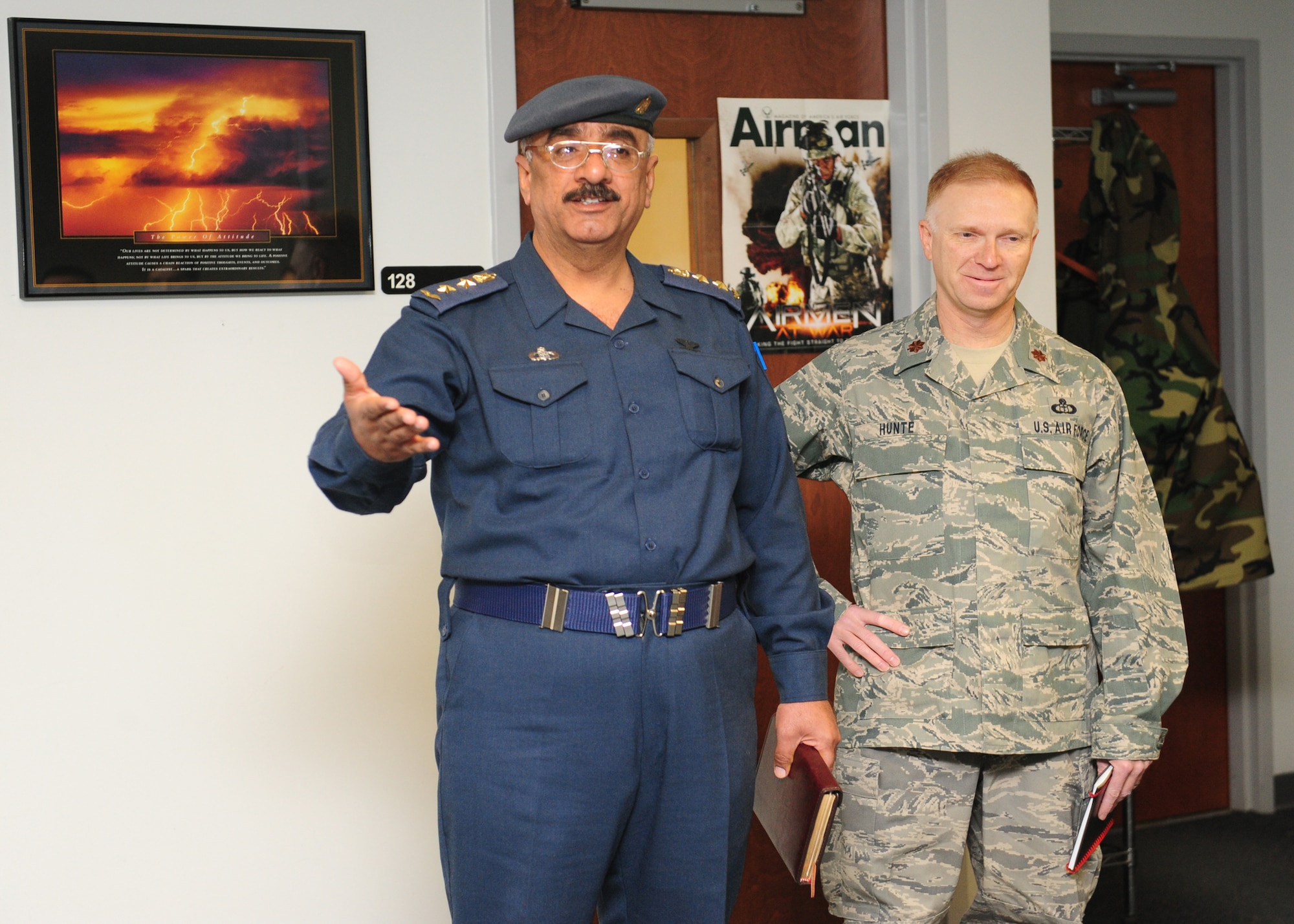 Col. Salman (left), Iraqi air force meteorological department director and senior meteorologist, and Maj. Barry Hunte, Iraqi Air Force weather advisor, express appreciation to the Airmen of the 28th Operational Weather Squadron Feb. 16.  Col. Salman develops doctrine, policy, requirements, and standards to organize, train, and equip the meteorological department to support the Iraqi air force as well as the ministry of defense and other government of Iraq agencies. (U.S. Air Force photo/2nd Lt. Tony Richardson)