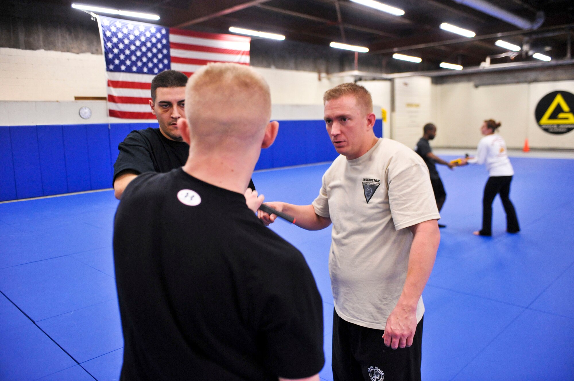 FORT RICHARDSON, Alaska – Jeremy Alf works on gun dislodging techniques with two individuals that participated in his Krav Maga class Feb. 1. Alf, who works in the 3rd Medical Group as a cardiopulmonary technician, teaches Krav Maga Mondays from 6-8 p.m. at Fort Richardson’s Geronimo gym. (Air Force photo by Airman 1st Class Christopher Gross)   

