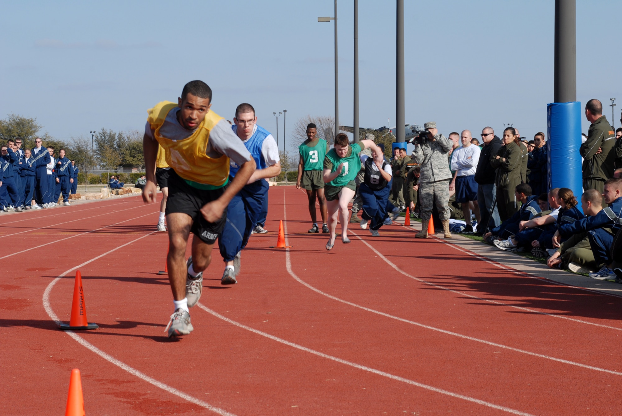 GOODFELLOW AIR FORCE BASE, Texas -- Runners begin the final event of sports day, Feb. 12, 2010. The final event was a 1-mile relay to decide which unit would take home the quarterly sports day trophy. (U.S. Air Force photo/Staff Sgt. Laura R. McFarlane)
