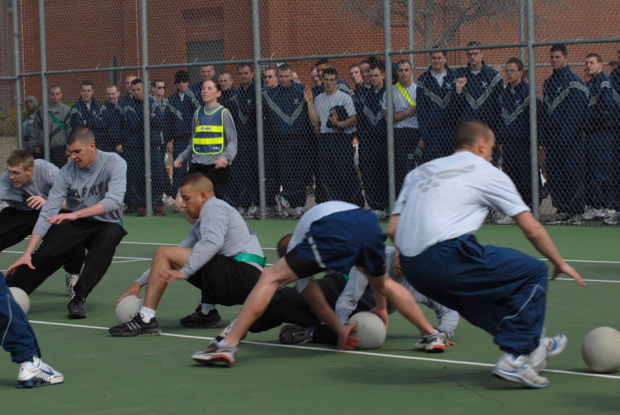 GOODFELLOW AIR FORCE BASE, Texas -- Soldiers and Airmen begin a game of doge ball during sports day, Feb. 12, 2010. Sports day provided a variety of activities for all participants including volleyball, tennis, dodge ball and more. (U.S. Air Force photo/Staff Sgt. Laura R. McFarlane)
