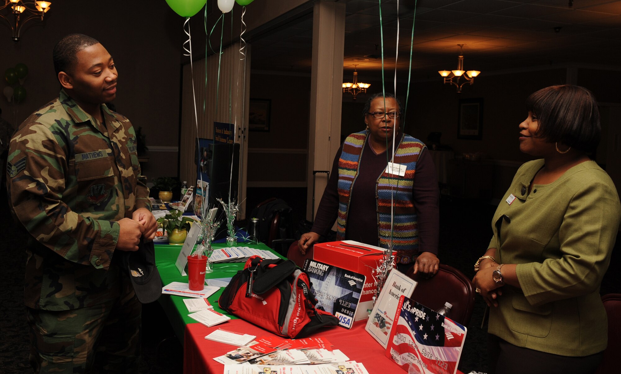 Senior Airman Lee Mathews, 4th Civil Engineer Squadron lead firefighter, talks to Nakeea Hieke, Bank of America senior personal banker, about the benefits of having a checking and savings account during a Financial Fair on Seymour Johnson Air Force Base N.C., Feb. 12, 2010. (U.S. Air Force photo/Senior Airman Whitney Lambert)