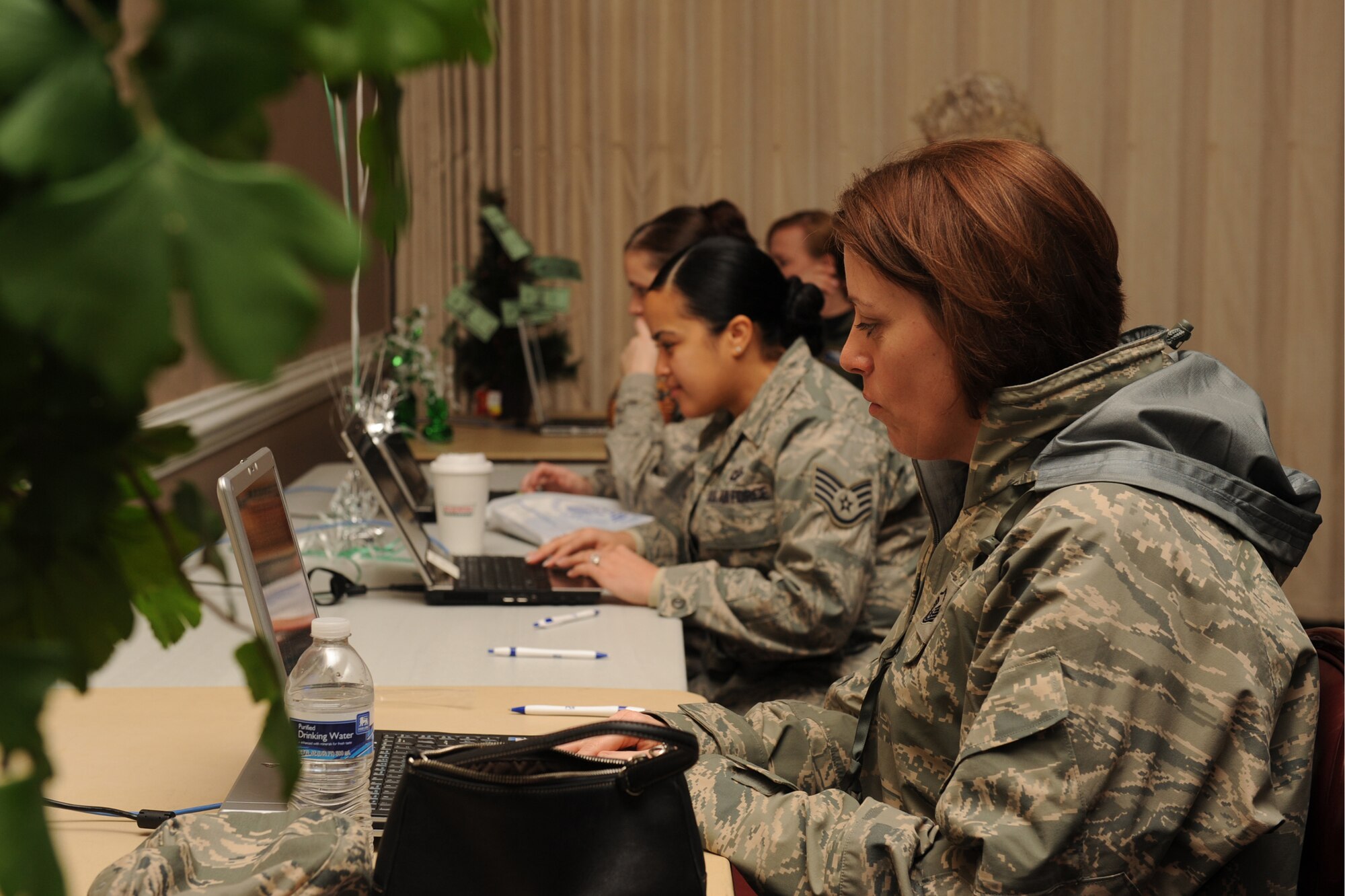 Airmen log onto militarysaves.org during a Financial Fair on Seymour Johnson Air Force Base N.C., Feb. 12, 2010. At the website the Airmen pledged to save or invest their money throughout the year. Making a pledge, they are entered into a drawing for a money tree. (U.S. Air Force photo/Senior Airman Whitney Lambert)