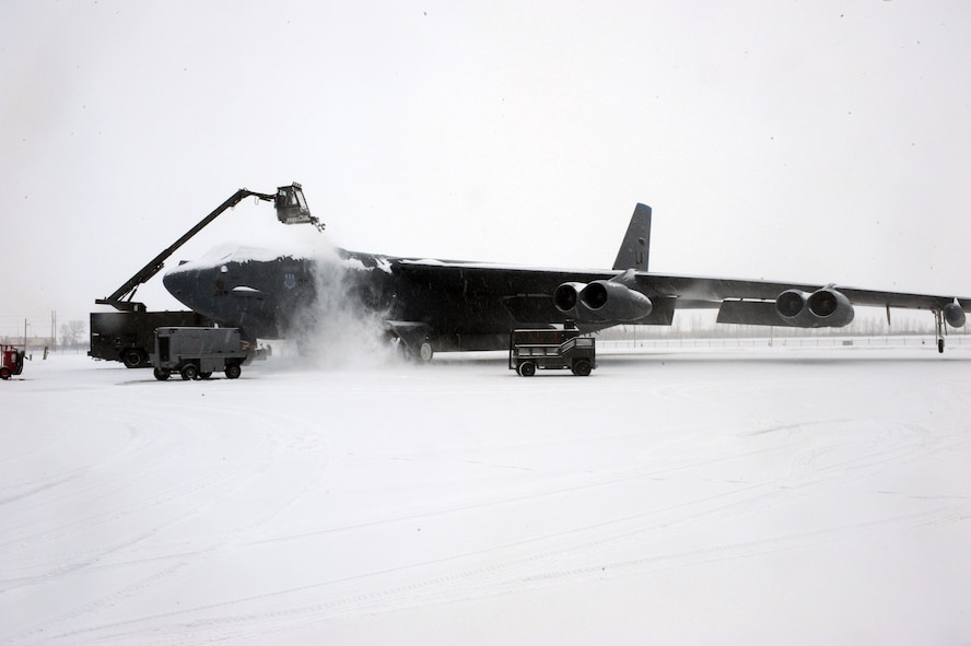 MINOT AIR FORCE BASE, N.D. – Senior Airman Matthew McAllister, 5th Aircraft Maintenance Squadron crew chief, de-ices a B-52H Stratofortress during pre-flight preparations Feb. 5. De-icing the aircraft is a vital procedure essential to maintaining a safe, secure and reliable takeoff. (U.S. Air Force photo by Senior Airman Jesse Lopez)
