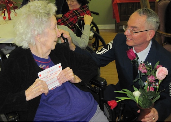 Chief Master Sgt. (Ret) Pat McCabe joined more than 90 Eglin Airmen to present valentines to local retirement homes Feb. 12.  The veterans were presented with a rose and a home-made card from local children.  (U.S. Air Force photo/Minty Knighton.)