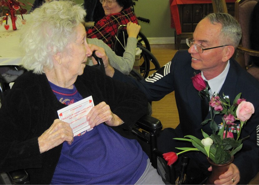 Chief Master Sgt. (Ret) Pat McCabe joined more than 90 Eglin Airmen to present valentines to local retirement homes Feb. 12.  The veterans were presented with a rose and a home-made card from local children.  (U.S. Air Force photo/Minty Knighton.)