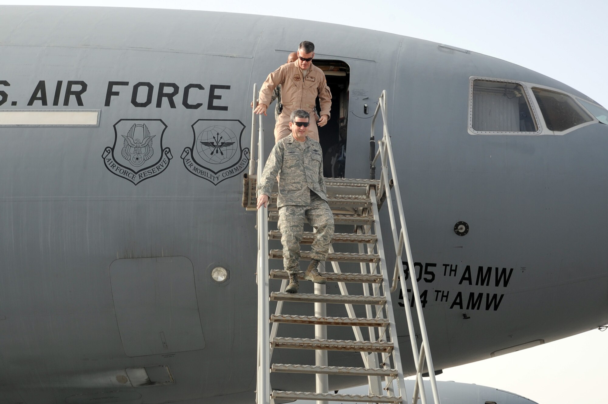 Lt. Gen. Rusty Findley, Air Mobility Command vice commander at Scott Air Force Base, Ill., steps down from a KC-10 Extender deployed with the 908th Expeditionary Air Refueling Squadron at a non-disclosed base in Southwest Asia on Feb. 11, 2010. General Findley was getting an overview of the KC-10 mission with the 908th EARS during his visit to the 380th Air Expeditionary Wing. The KC-10 in the photo is deployed from Joint Base McGuire-Dix-Lakehurst, N.J.  (U.S. Air Force Photo/Master Sgt. Scott T. Sturkol/Released)