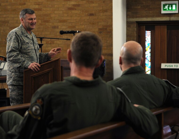 RAF MILDENHALL, England -- Chap. (Brig. Gen.) David Cyr, Air Force deputy chief of chaplains, speaks on the theme, "God, bless America" as the guest speaker for this year's annual RAF Mildenhall National Prayer Luncheon Feb. 12 at the 100th Air Refueling Wing Chapel. "It behooves us to remember how it is we got here today," said Chaplain Cyr. "God, bless America. It's written on our money, and it's written on our hearts." (U.S. Air Force photo/Senior Airman Thomas Trower)