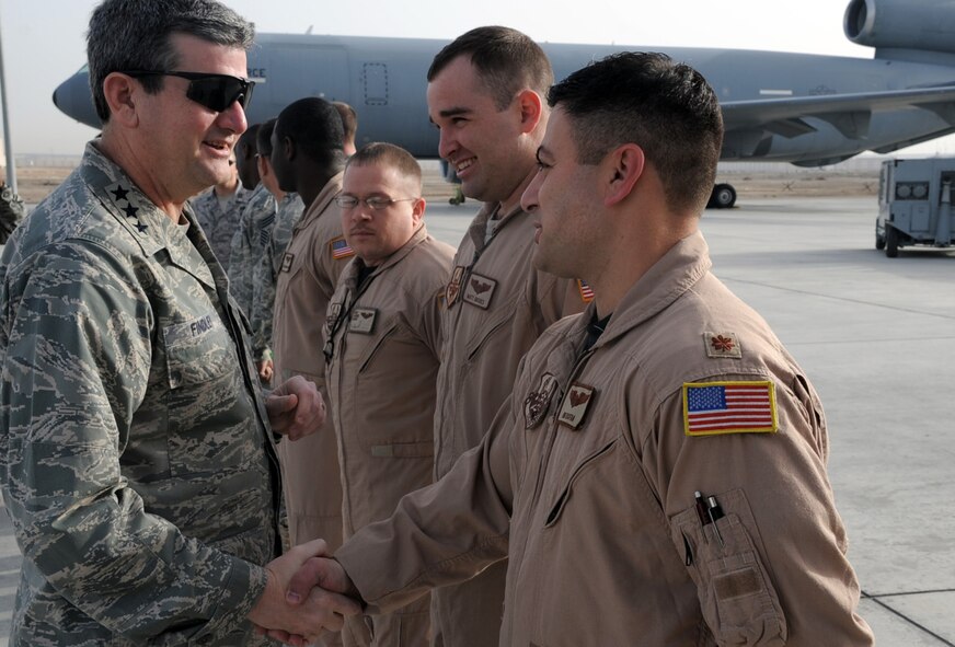 Lt. Gen. Rusty Findley, Air Mobility Command vice commander at Scott Air Force Base, Ill., greets with Maj. Ben Yosfan and other mobility Airmen of the 380th Air Expeditionary Wing at a non-disclosed base in Southwest Asia on Feb. 11, 2010. General Findley visited the 380th AEW as part of a trip through the U.S. Central Command area of responsibility. (U.S. Air Force Photo/Master Sgt. Scott T. Sturkol/Released)
