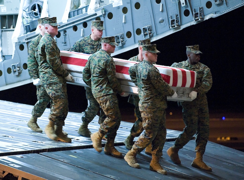 A U.S. Marine Corps team transfers the remains of Marine Corps Cpl. Jacob H. Turbett, of Wayne, Michigan, at Dover Air Force Base, Del., on February 14, 2010.  (U.S. Air Force photo/Brianne Zimny)